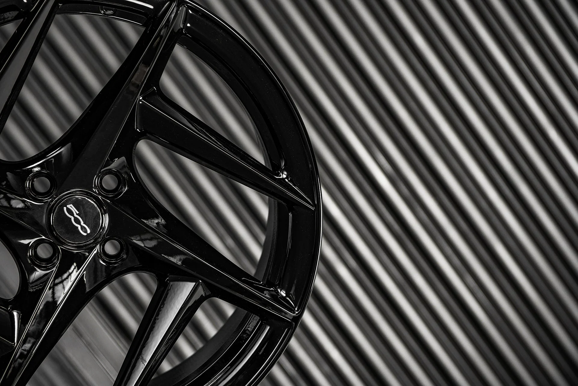 Type 52 alloy wheel against textured dark background
