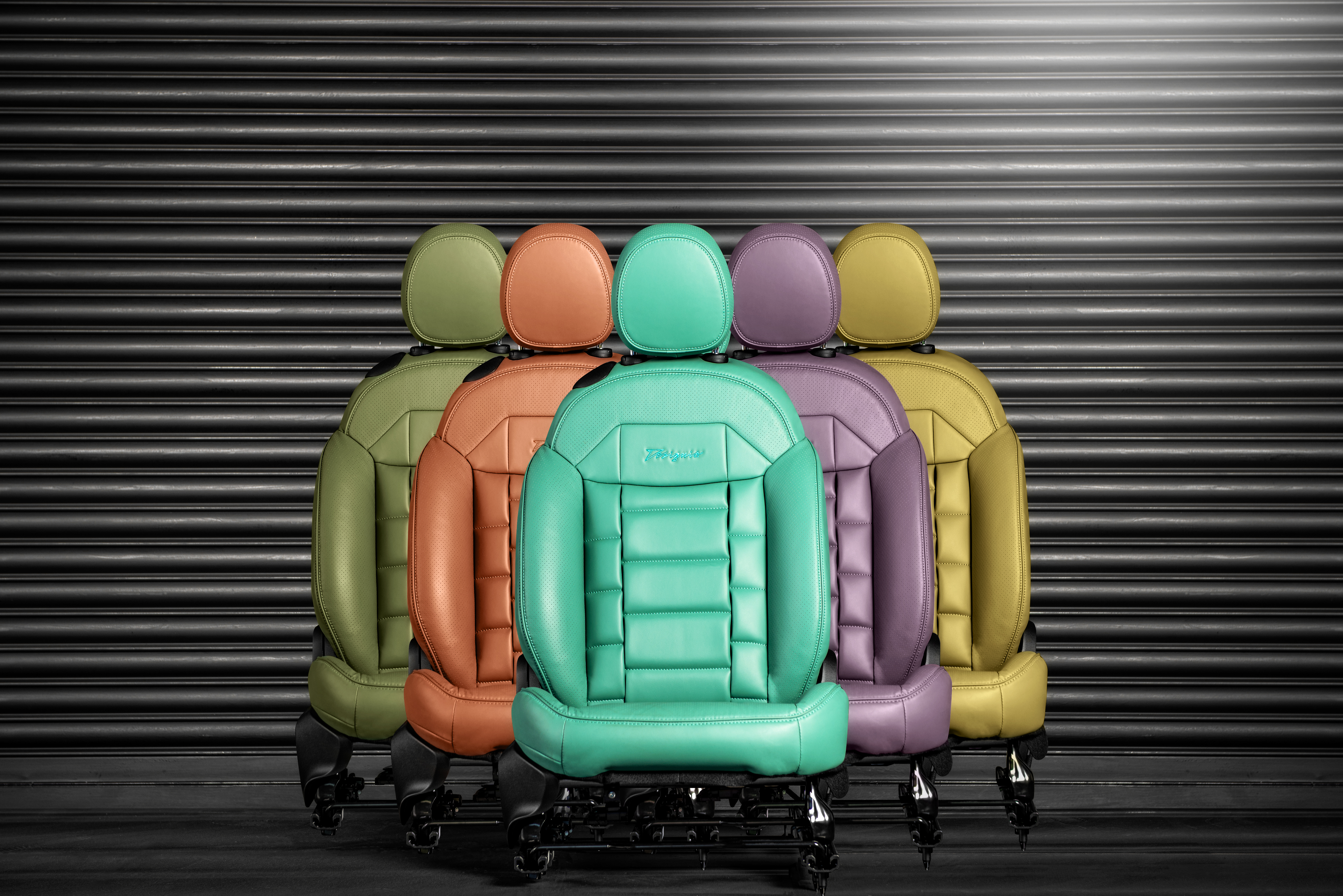 Designio Fiat 500e interior — quilted eco-leather seats in teal with contrast stitching