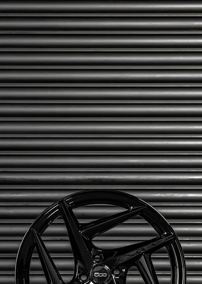 Type 52 alloy wheel against textured dark background